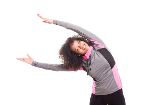 Studio shot of a beautiful african woman exercising
