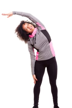 Studio shot of a beautiful african woman exercising