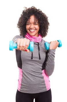 Studio shot of a beautiful african woman exercising