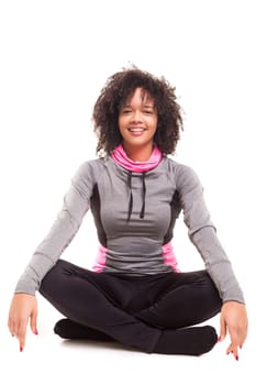 Studio shot of a beautiful african woman exercising