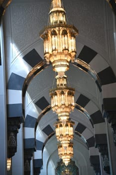 Hanging chandeliers in the archway of the Sultan Qaboos Grand Mosque in Muscat.