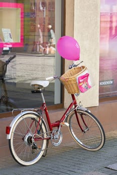 Telekom advertising campaign in front of a branch in the old town of Swinoujscie in Poland