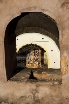View of Ganesha Temple through window at Fort in Jhansi, Uttar Pradesh, India, Asia
