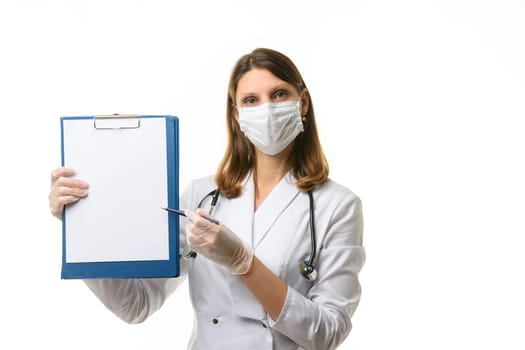 The doctor shows with a pen something in a tablet with a white sheet of paper