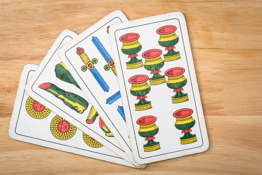 Primiera italian card on a wood background