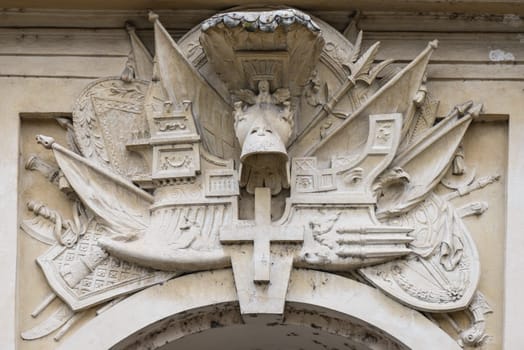 Embossed Ship over a door of The garden of the Oranges