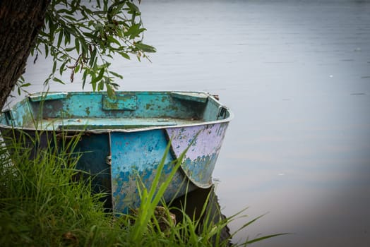 An old boat along the Kharkiv River, Ukraine
