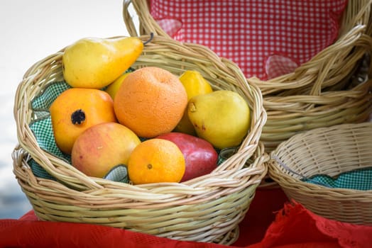 Oranges, apples and pears in a wicker basket