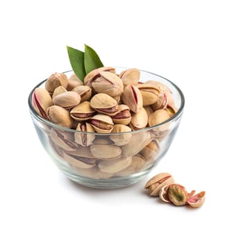 Pistachios in Glass Bowl on white background