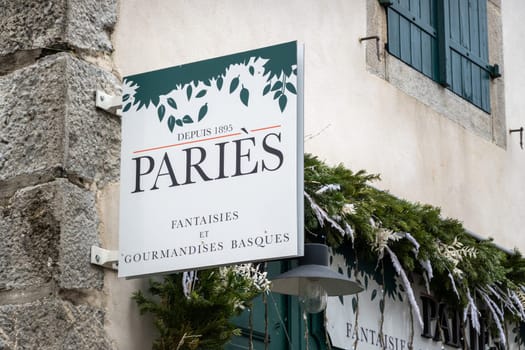 ESPELETTE, FRANCE - CIRCA JANUARY 2021: Paries sign outside shop. Paries is a chocolate, pastry, ice cream and confectionery maker from the French Basque Country.