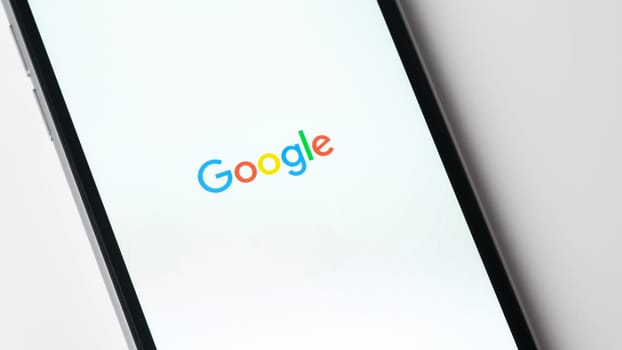BAYONNE, FRANCE - CIRCA JANUARY 2021: Google app launching on Apple iPhone 6S. The google app gives access to the Google search engine.