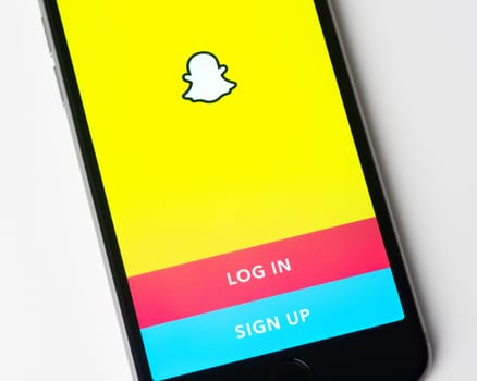 BAYONNE, FRANCE - CIRCA JANUARY 2021: Snapchat app log in and sign up page on Apple iPhone screen. Snapchat is a multimedia messaging app developed by Snap Inc.