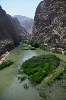 A view into Wadi Shab - Wadi ash Shab with its steep,deep gorge in Oman