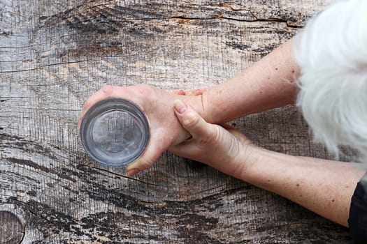 A woman with Parkinson's disease has very strong trembling hands