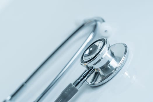 Stethoscope for doctor checkup in health medical laboratory table as medical concept
