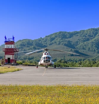 Helicopter on the helipad on Kamchatka