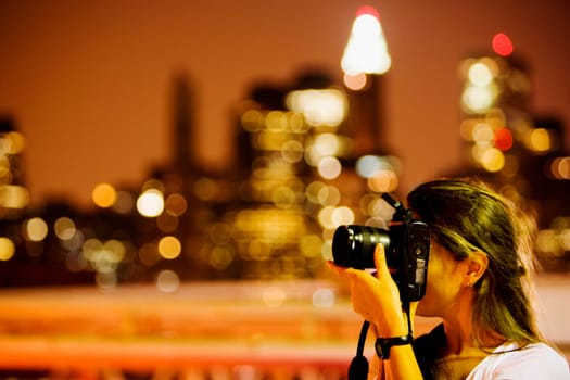 Close-up of a woman taking a photograph