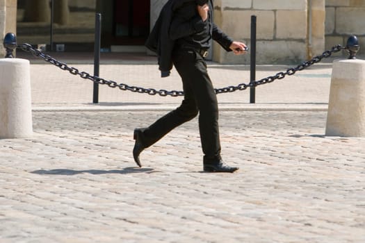 Side profile of a businessman walking