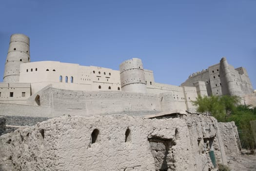 The great fortress Hisn Tamah,built in the 17th century in the oasis city of Bahla,is located at the foot of the Jabal al Achdar Mountains. It was built from traditional building materials.