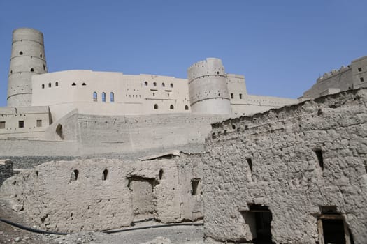 The great fortress Hisn Tamah,built in the 17th century in the oasis city of Bahla,is located at the foot of the Jabal al Achdar Mountains. It was built from traditional building materials.
