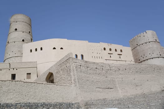 The great fortress Hisn Tamah,built in the 17th century in the oasis city of Bahla,is located at the foot of the Jabal al Achdar Mountains. It was built from traditional building materials.