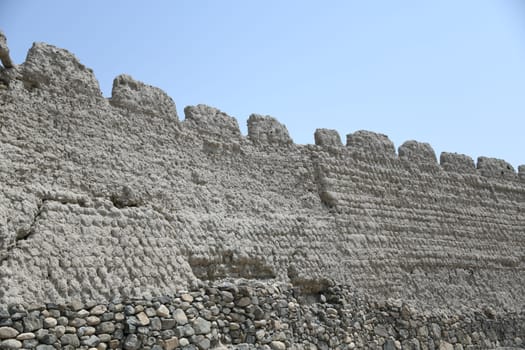 The great fortress Hisn Tamah,built in the 17th century in the oasis city of Bahla,is located at the foot of the Jabal al Achdar Mountains. It was built from traditional building materials.