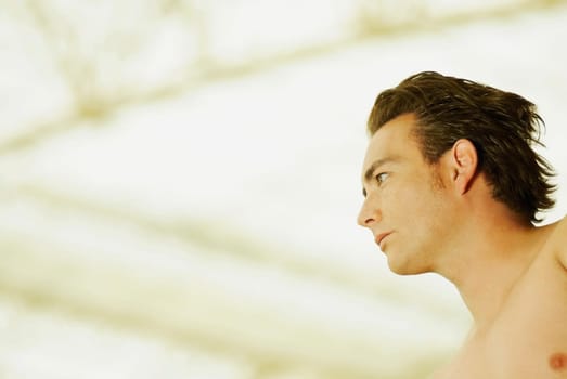 Low angle view of a young man looking away