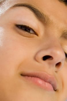 Close-up of a boy with his eyebrow raised