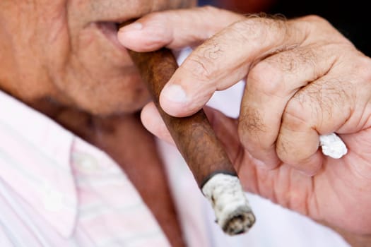 Close-up of a mature man smoking a cigar