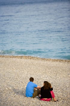 High angle view of a young couple relaxing on the beach