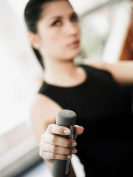 Portrait of a young woman exercising