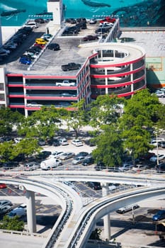 Elevated railway track in front of a parking building, Miami, Florida, USA