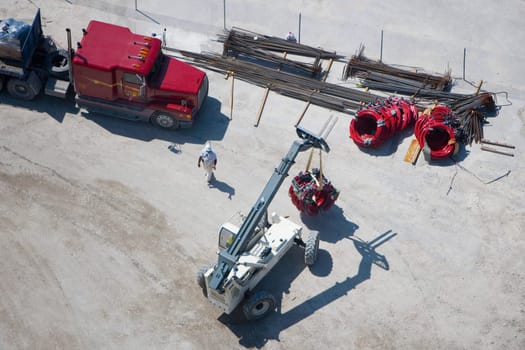 High angle view of a crane with a vehicle trailer