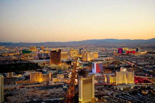 High angle view of buildings in a city lit up at dusk, Las Vegas, Nevada, USA