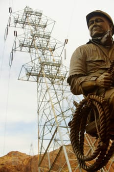 Low angle view of a statue in front of an electricity pylon, Las Vegas, Nevada, USA