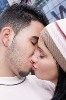Close-up of a mid adult woman and a young man kissing each other