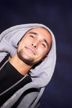 Low angle view of a young man smiling
