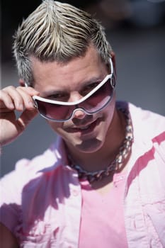 Portrait of a mid adult man wearing sunglasses and smiling