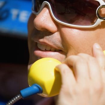 Close-up of a mid adult man talking on the telephone