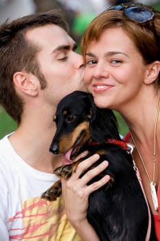 Young man kissing a young woman