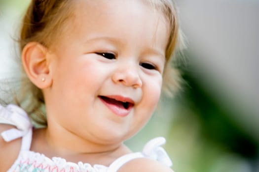 Close-up of a baby girl smiling