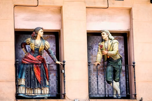 Statues on the balconies of a building, Madrid, Spain