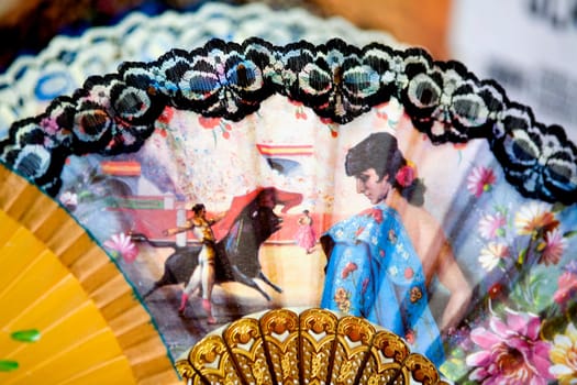 Close-up of paintings on hand fans