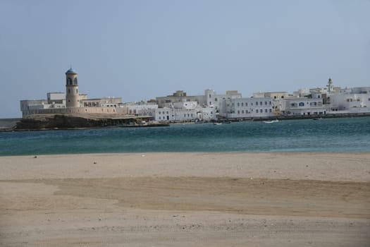 The lighthouse in the small town of Al Ayjah in Oman is located on the Gulf of Oman and opposite the port city of Sur with its famous dhow shipyard.