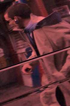 Reflection of a businessman on the glass