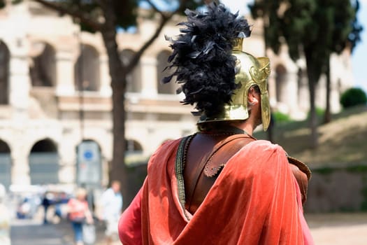 Rear view of a man wearing a warrior costume, Rome, Italy