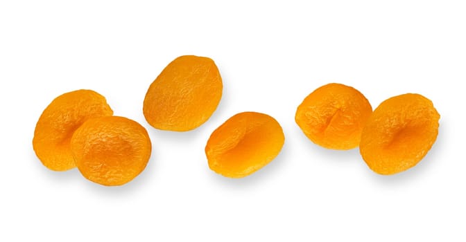 Isolated fruit banner. Dried apricot fruits with clipping path on white background with shadows. Flat lay. Full death of field.