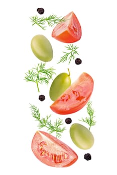 Isolated vegetables. Mixed tomatoes, dill, green olives and black pepper corns in the air isolated on white with clipping path as package design element. Full depth of field. Food levitation concept