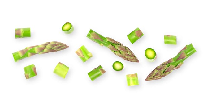 Isolated vegetables banner. Green asparagus vegetables with clipping path on white background with shadows. Flat lay. Full death of field.