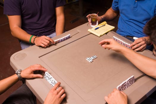 Young men playing dominos